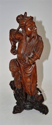 Lot 414 - A Chinese carved hardwood figures of Wudi