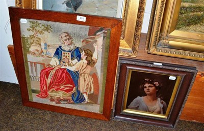 Lot 424 - Oak framed woolwork depicting a religious scene and a framed chystoleum of a maiden(2)