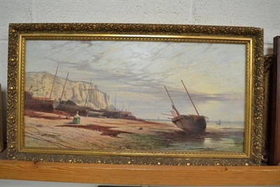 Lot 447 - A pair of oils on canvas, fishing boats on a rock coastline near East Hill, Hastings, and Glynn...