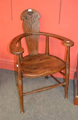 Lot 894 - A Set of Four Scottish Arts and Crafts Oak Chairs, the shaped splat carved with a thistle,...