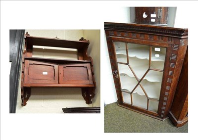 Lot 498 - A late 19th century oak hanging glazed corner cabinet