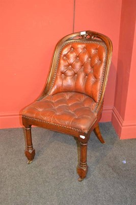 Lot 897 - A Victorian Gothic Revival Walnut Library Chair, with pierced top rail, upholstered deep orange...