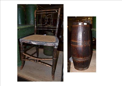 Lot 506 - A staved oak stickstand and a painted cane-seat chair