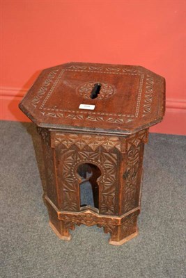 Lot 898 - A Moorish Carved Hardwood Stool, possibly retailed by Liberty & Co, octagonal form with arched...