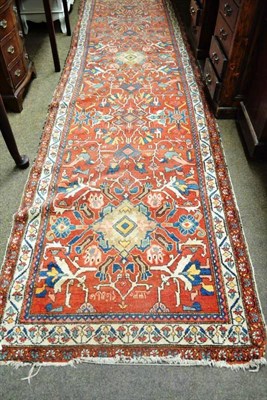 Lot 514 - A red ground Eastern pattern runner