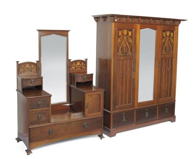 Lot 900 - A Shapland & Petter Ltd of Barnstable Arts & Crafts Wardrobe, circa 1900, the bold cornice with...