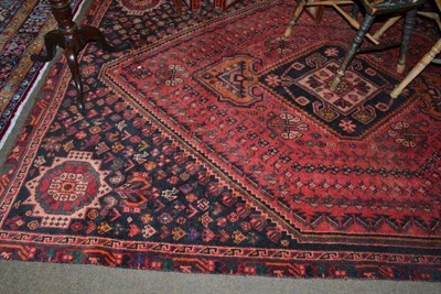 Lot 547 - Kashgai carpet South West Persia, The rose pink lozenge field framed by spandrels and narrow...