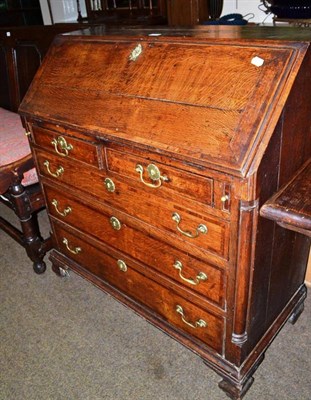 Lot 549 - A Georgian oak inlaid bureau