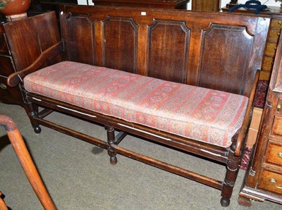 Lot 550 - Large Georgian oak panel back settee