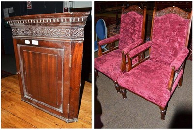 Lot 553 - A pair of Edwardian red upholstered armchairs with button backs and a small mahogany corner...