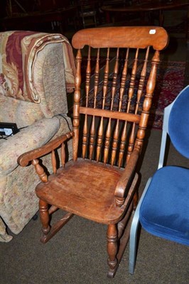 Lot 554 - Ash double spindle rocking chair