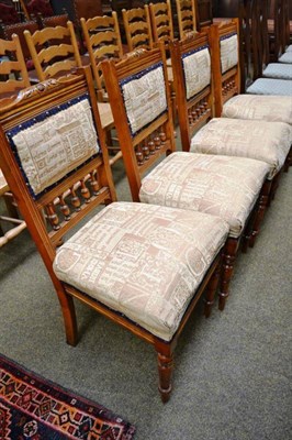 Lot 562 - Four late Victorian carved oak dining chairs