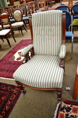 Lot 569 - Victorian mahogany framed open arm chair with green striped linen upholstery