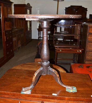 Lot 590 - A 19th century oak tripod occasional table