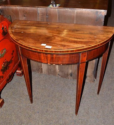 Lot 599 - A 19th century mahogany inlaid folding card table