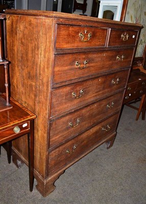 Lot 601 - A Georgian oak five height chest of drawers