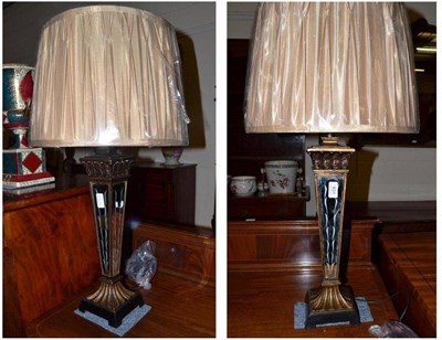 Lot 631 - A pair of mirrored lamps with shades