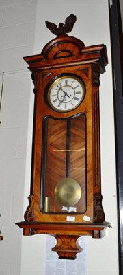 Lot 636 - Walnut wall clock with pendulum