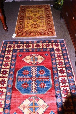 Lot 641 - Caucasian design rug Northern Afghanistan, the abrashed crimson field centred by an indigo...