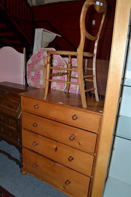 Lot 666 - A pine four height chest of drawers and a bedroom chair