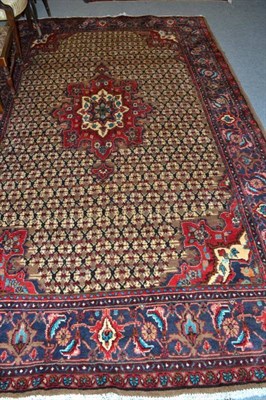 Lot 706 - Hamadan village carpet Persian Kurdistan, the lattice field centred by a tomato red medallion...