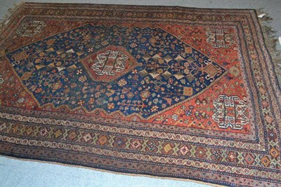 Lot 724 - Kashgai rug South West Persia, the abrashed field of stylised plants around a stepped medallion...