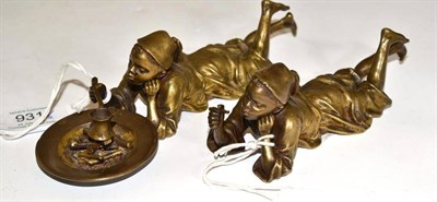 Lot 931 - A Pair of Bergman Bronze Figures of Arab Boys, early 20th century, both recumbent, one smoking...