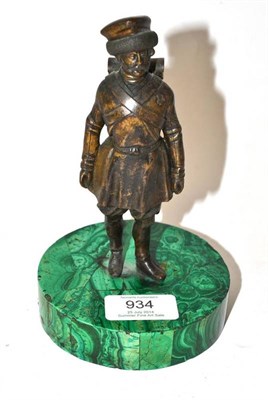 Lot 934 - A Bronze Figure of a Russian Cossack, standing wearing military uniform with medals, on a malachite