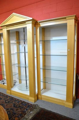 Lot 696A - A modern break front cabinet with glass shelves, central circular glass display shelves and...