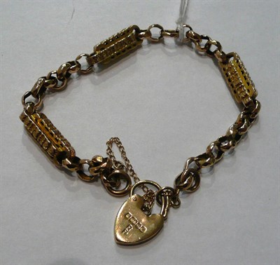 Lot 8 - A star and bar link bracelet (worn) with padlock catch
