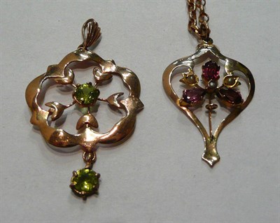 Lot 28 - A peridot pendant with chain and an Art Nouveau pendant on chain