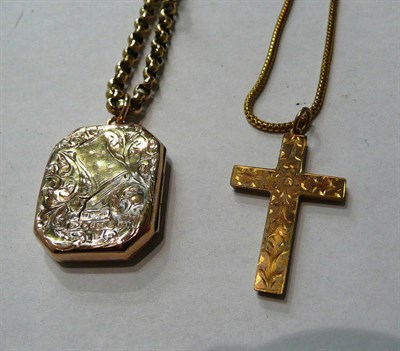 Lot 39 - An engraved cross, a locket and two chains