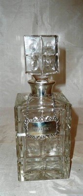 Lot 73 - Glass decanter with silver collar and label