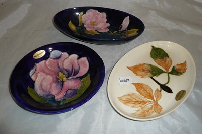 Lot 74 - Walter Moorcroft Magnolia plate and dish and a leaf patterned dish (3)