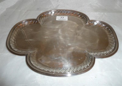 Lot 77 - A white metal tray with decorated border