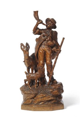 Lot 944 - A Swiss  "Black Forest " Carved Wood Group, late 19th/early 20th century, of a herdsman with a horn