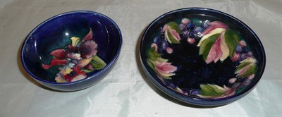 Lot 89 - Walter Moorcroft Leaf and Berry bowl and a Walter Moorcroft Orchid bowl (2)