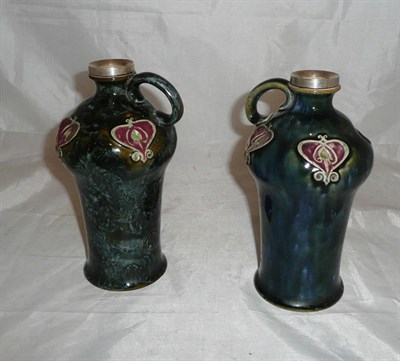 Lot 91 - Two Doulton stoneware Art Nouveau vases with silver collars