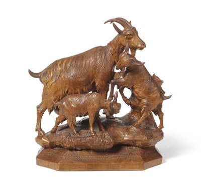 Lot 945 - A Swiss  "Black Forest " Carved Wood Group, late 19th/early 20th century, of an Ibex and her...