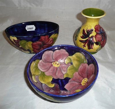 Lot 97 - Two Walter Moorcroft Hibiscus vases and a Clematis bowl (3)