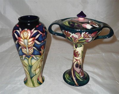 Lot 103 - Modern Moorcroft collectors club twin handled vase and cover designed by Emma Bossoms and a...