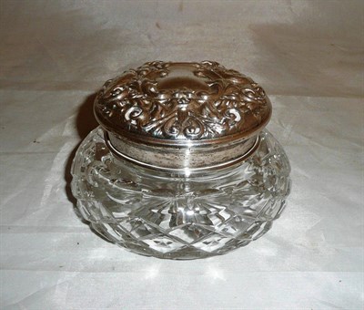 Lot 115 - A cut glass jar with silver lid