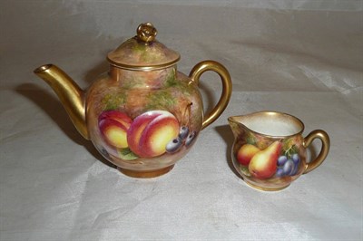 Lot 130 - Royal Worcester miniature tea pot and jug painted with fruit