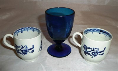 Lot 135 - Two 18th century blue and white cups and a blue wine glass