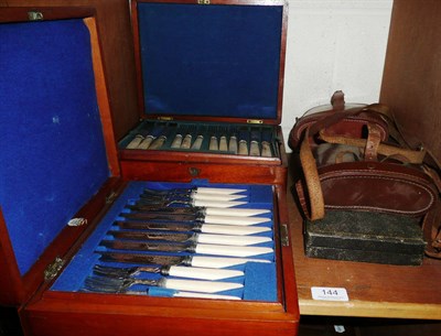 Lot 144 - Two cased sets of fruit knives, two pairs of binoculars and a carving set