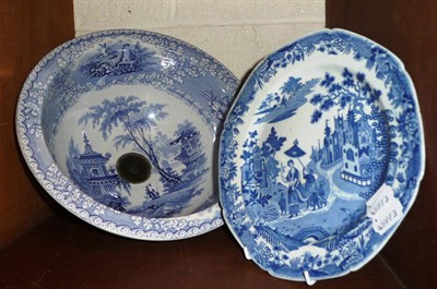 Lot 148 - An English blue and white pottery wash basin and a transfer decorated plate