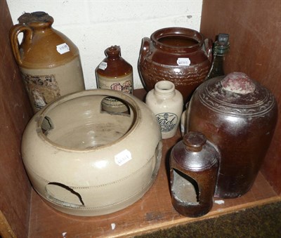 Lot 150 - A small collection of stoneware vessels and a glass bottle