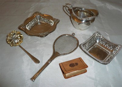 Lot 159 - Small silver jug, pierced silver dishes, sifter spoon, tennis racket and small book