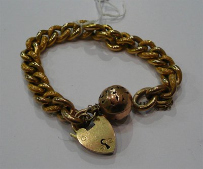 Lot 164 - A charm bracelet and loose watch key