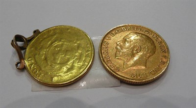 Lot 172 - A 1911 full sovereign and a worn pond coin